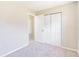 Bedroom featuring carpeted floors, neutral walls, and closet storage at 1418 Delaware Ave, St Cloud, FL 34769
