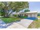 This well-maintained home has a green lawn and ample parking space at 1418 Delaware Ave, St Cloud, FL 34769
