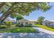 Charming single-story home features a well-manicured lawn and carport at 1418 Delaware Ave, St Cloud, FL 34769