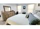 Bright bedroom features a dresser, desk, and two windows with sheer curtains at 14620 Golden Rain Tree Blvd, Orlando, FL 32828