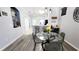 Open concept dining area with modern decor and seamless flow to the kitchen at 14620 Golden Rain Tree Blvd, Orlando, FL 32828