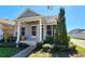 Charming single-story home with a welcoming front porch and well-manicured landscaping at 14620 Golden Rain Tree Blvd, Orlando, FL 32828