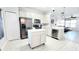 Bright kitchen with island, stainless steel appliances, and modern lighting at 14620 Golden Rain Tree Blvd, Orlando, FL 32828