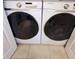 Modern laundry area with Samsung washer and dryer, convenient for everyday chores at 14620 Golden Rain Tree Blvd, Orlando, FL 32828