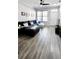 Bright living room with modern furnishings and luxury vinyl plank flooring at 14620 Golden Rain Tree Blvd, Orlando, FL 32828