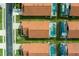 Overhead view of the property with a private, screened-in pool and well-kept lawn at 151 Saragossa Ave, Davenport, FL 33897