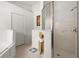 Bathroom featuring a bathtub and stand up shower with glass doors at 151 Saragossa Ave, Davenport, FL 33897
