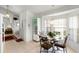 Bright dining area with tile flooring and a glass-top dining table with seating for four at 151 Saragossa Ave, Davenport, FL 33897