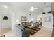 Spacious living room offering comfortable seating, natural light, and tile flooring at 151 Saragossa Ave, Davenport, FL 33897