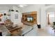 Bright living room featuring a media center, comfortable seating, and tile flooring at 151 Saragossa Ave, Davenport, FL 33897