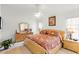 Main bedroom featuring a queen-sized bed, dresser, and two nightstands at 151 Saragossa Ave, Davenport, FL 33897