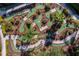 Aerial view of an elaborate mini-golf course featuring winding paths, green fairways, and diverse landscaping at 151 Saragossa Ave, Davenport, FL 33897