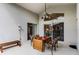 Covered patio featuring an outdoor dining table, ceiling fan and plenty of natural light at 151 Saragossa Ave, Davenport, FL 33897