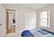 Bedroom featuring a closet and window that provides ample sunlight at 153 Laurel Ridge Pass, Davenport, FL 33897