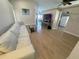 Spacious living room featuring a ceiling fan, and a TV on a media console at 153 Laurel Ridge Pass, Davenport, FL 33897