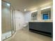 Modern bathroom featuring a double sink vanity and a glass enclosed shower at 175N Pearl Lake Cswy # 114, Altamonte Springs, FL 32714