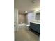 Clean bathroom featuring a tiled shower-tub combo and modern vanity at 175N Pearl Lake Cswy # 114, Altamonte Springs, FL 32714