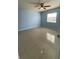 Cozy bedroom with a ceiling fan, tile floors, and a window providing natural light at 175N Pearl Lake Cswy # 114, Altamonte Springs, FL 32714