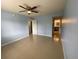 Spacious bedroom featuring neutral color walls, tile floors and a ceiling fan at 175N Pearl Lake Cswy # 114, Altamonte Springs, FL 32714