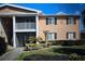 Charming townhouse exterior with a well-manicured lawn and balcony at 175N Pearl Lake Cswy # 114, Altamonte Springs, FL 32714