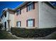 Two-story townhouse showcasing charming shutters and well-maintained landscaping at 175N Pearl Lake Cswy # 114, Altamonte Springs, FL 32714