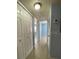 Bright hallway featuring tile floors and a closet for ample storage at 175N Pearl Lake Cswy # 114, Altamonte Springs, FL 32714