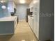 Updated kitchen featuring bright cabinetry, stainless steel appliances, and tile flooring at 175N Pearl Lake Cswy # 114, Altamonte Springs, FL 32714