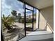 Enclosed outdoor lanai offering a tranquil space with a view of landscaped grounds at 175N Pearl Lake Cswy # 114, Altamonte Springs, FL 32714