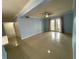 Spacious living room with neutral paint, tile flooring, and access to outdoor patio at 175N Pearl Lake Cswy # 114, Altamonte Springs, FL 32714