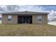 Spacious backyard with patio area, perfect for outdoor entertaining and relaxation at 1919 Escambia Ln, Kissimmee, FL 34759