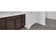Bathroom with a large brown vanity with white countertops and modern vinyl floors at 1919 Escambia Ln, Kissimmee, FL 34759