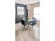 Dining Room features a modern lighting fixture and a glass table with black chairs at 1919 Escambia Ln, Kissimmee, FL 34759