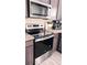 Close up of kitchen features including stainless steel oven and granite counters at 1919 Escambia Ln, Kissimmee, FL 34759