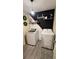 Stylish laundry room features modern appliances, decorative wall art, and ample lighting at 1919 Escambia Ln, Kissimmee, FL 34759