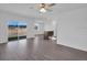 Living Room features modern wood grain floors and a large window with backyard view at 1919 Escambia Ln, Kissimmee, FL 34759