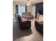 Cozy living room with modern furniture, hardwood floors, and neutral decor at 1919 Escambia Ln, Kissimmee, FL 34759
