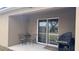 Covered patio with seating, perfect for outdoor dining and relaxation at 1919 Escambia Ln, Kissimmee, FL 34759
