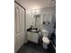Bathroom with toilet, cabinet and sink at 2019 Dixie Belle Dr # 2019L, Orlando, FL 32812