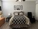 Bedroom featuring a queen size bed and simple decor at 2019 Dixie Belle Dr # 2019L, Orlando, FL 32812