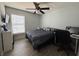 Bedroom featuring natural light, fan, and wood-look vinyl flooring at 2019 Dixie Belle Dr # 2019L, Orlando, FL 32812