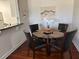 Dining room with glass table and four chairs at 2019 Dixie Belle Dr # 2019L, Orlando, FL 32812