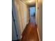 Hallway with hardwood floors and a closet to the left at 2019 Dixie Belle Dr # 2019L, Orlando, FL 32812