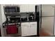 Kitchen with white cabinets and stainless steel appliances at 2019 Dixie Belle Dr # 2019L, Orlando, FL 32812