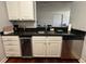 Kitchen area featuring granite countertops and stainless steel dishwasher at 2019 Dixie Belle Dr # 2019L, Orlando, FL 32812