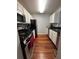 Galley kitchen with updated stainless steel appliances at 2019 Dixie Belle Dr # 2019L, Orlando, FL 32812