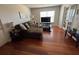 Living room area with hardwood floors, sofa and coffee table at 2019 Dixie Belle Dr # 2019L, Orlando, FL 32812