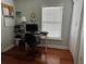 Well-lit office space with wood floors, a large window, and ample desk area at 2019 Dixie Belle Dr # 2019L, Orlando, FL 32812