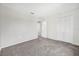Carpeted bedroom featuring a spacious closet and neutral tones at 2450 Parsons Pond Cir, Kissimmee, FL 34743