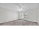 Comfortable bedroom with ceiling fan and large window offering an abundance of light at 2450 Parsons Pond Cir, Kissimmee, FL 34743