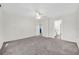 Spacious bedroom with a ceiling fan, view, and easy access to the attached bath at 2450 Parsons Pond Cir, Kissimmee, FL 34743